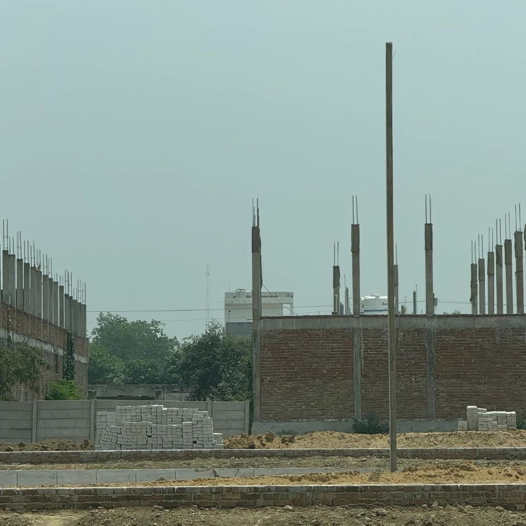 Dwarika Enclave construction site showing foundation work